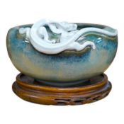 A Japanese Sumidagawa ware ‘dragon’ bowl, Meiji period, signed Ishiguro Koko, wood stand.