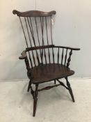 A 20th century American Windsor beech comb back armchair, width 73cm, depth 51cm, height 113cm.