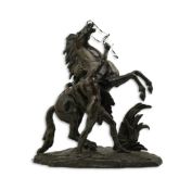 After Guillaume Coustou (1677-1746), a bronze Marli horse group with rearing horse and groom, on