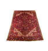 A North West Persian blue ground carpet, with geometric motifs, multi-bordered, 391 x 310cm PLEASE