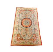 A Savonnerie carpet, with central rosette on a field of scrolling shell and foliate motifs, 372 x