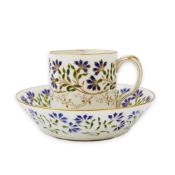 Camille Naudot (1862-1938), a rare porcelain and openwork enamel coffee cup and saucer, c.1900,