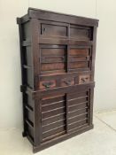 A 19th century Japanese wooden storage cupboard, width 106cm, depth 44cm, height 172cm.