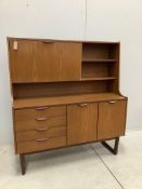 A mid century 'Europa Furniture' simulated teak sideboard, width 125cm, depth 46cm, height 138cm.