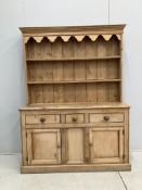 A Victorian pine dresser with associated boarded rack, width 136cm, depth 42cm, height 182cm.