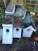 Five painted wood garden bird boxes with copper scale roofs, largest height 38cm. Condition - fair