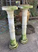 A pair of reconstituted stone garden pedestals, height 99cm. Condition - fair