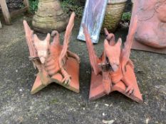 A pair of terracotta griffon ridge tiles, height 35cm. Condition - fair