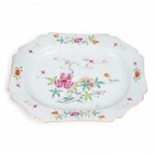 A Chinese famille rose serving dish, Qianlong period, 41cm wide. Condition - some firing faults.
