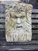 A reconstituted stone green man garden wall plaque, width 40cm, height 57cm. Condition - fair