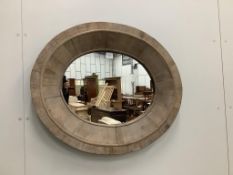 A Contemporary veneered oval wall mirror, width 83cm, height 70cm. Condition - fair to good