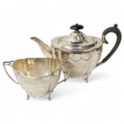 An ornate Edwardian silver oval teapot and sugar bowl, by Roberts & Belk, Sheffield, 1906, gross