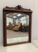 A Victorian carved oak overmantel mirror, width 120cm, height 152cm. Condition - fair