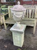 A reconstituted stone lidded garden urn on square pedestal, height 104cm. Condition - fair