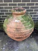 A Greek style terracotta oil jar, height 75cm. Condition - fair