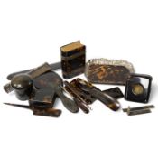 A group of tortoiseshell items including a silver mounted pin tray by William Comyns, London,