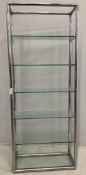 A contemporary chrome and clear glass five tier open shelf unit, width 79cm, depth 33cm, height