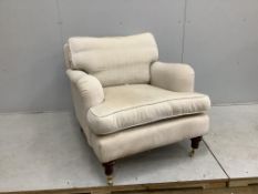 A reproduction Howard style upholstered armchair, width 86cm, depth 100cm, height 82cm.