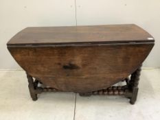 An 18th century oak gateleg table, width 122cm, depth 56cm, height 72cm. Condition - poor to fair