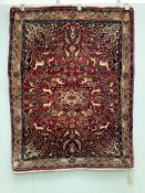 A Tabriz burgundy ground pictorial rug, 145 x 106cm. Condition - good