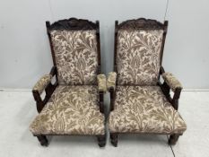 A pair of Victorian mahogany upholstered open armchairs, width 56cm, depth 62cm, height 101cm.