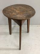 An early 19th century elm and fruitwood cricket table, diameter 46cm, height 66cm. Condition - fair