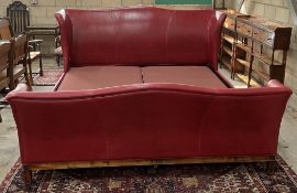 A Bonaparte red leather Emperor size bedframe, width 240cm, length 250cm, height 130cm. Condition -