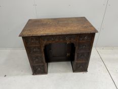 A Victorian carved oak kneehole desk, width 93cm, depth 55cm, height 74cm. Condition - fair