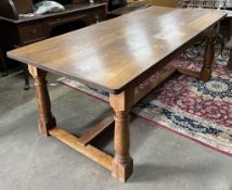A reproduction 17th century style rectangular oak refectory dining table, width 210cm, depth 92cm, h