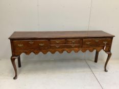 An 18th century style oak low dresser, width 198cm, depth 46cm, height 82cm. Condition - good