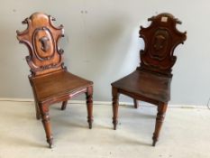 A pair of Victorian carved mahogany hall chairs, width 44cm, depth 39cm, height 90cm