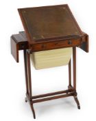 A Regency crossbanded satinwood writing and work table, with twin flap folding top enclosing a baize