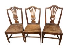 A set of three George III Provincial elm dining chairs, width 49cm, height 99cm