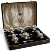 A cased six piece silver condiment set by Finnegans, Ltd, Birmingham, 1940, together with four earli
