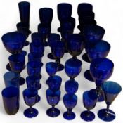 A collection of 19th century and later Bristol blue drinking glasses of various sizes, largest 16cm