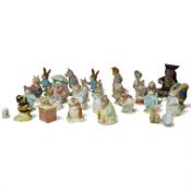 A collection of Beswick and Royal Albert Beatrix Potter figures and others, largest 13cm high