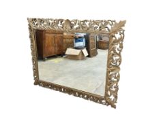 A late 19th / early 20th century rectangular carved giltwood wall mirror, width 97cm, height 124cm