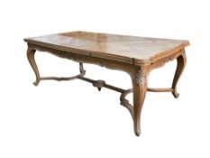 A French rectangular parquetry draw leaf dining table on acanthus carved cabriole legs, width 199cm,