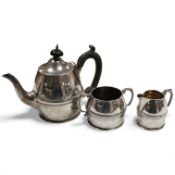 An Edwardian silver three piece bachelor's tea set, with reeded band, by Henry Stratford Ltd, Sheffi