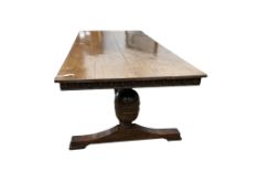An 18th century style rectangular oak refectory dining table, width 243cm, depth 103cm, height 76cm