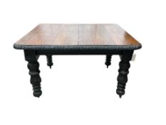 A late Victorian carved oak extending dining table, width 176cm extended, one spare leaf, depth 104c