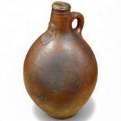 A Bellarmine stoneware jug, 17th century, 36cm high