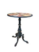 A circular specimen marble occasional table on a Victorian ebonised tripod base, diameter 53cm, heig