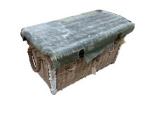 An early 20th century military part canvas covered wicker trunk, width 80cm, depth 42cm, height 50cm