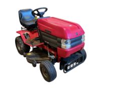 A Westwood S1300 ride on mower with scarifier and brass box attachments