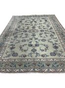 A Kashan pale green ground carpet, 380 x 260cm