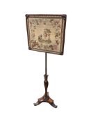An early Victorian rosewood pole screen with polychrome tapestry banner, height 155cm