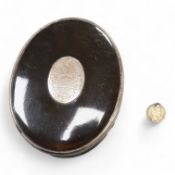A 19th century white metal mounted tortoiseshell oval snuff box, with inset oval white metal