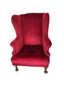 An early 20th century Queen Anne style upholstered wing armchair, width 83cm, depth 86cm, height