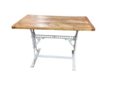 A Victorian painted cast iron table with rectangular pine top, width 110cm, depth 63cm, height 75cm